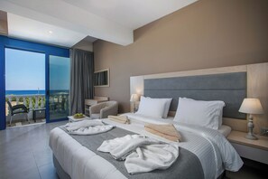 Master bedroom with a balcony view towards the sea