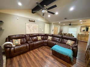 The living area is stunning, and it features a newly updated fan installed.