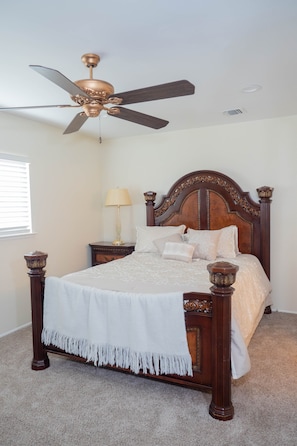 The Master bedroom has a queen-sized bed, closet, and a full bathroom with a tub