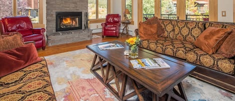 Living Room with Wood Burning Fireplace & Flat Screen TV