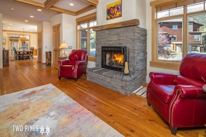 Living Room with Wood Burning Fireplace & Flat Screen TV