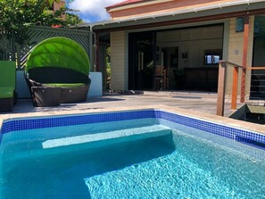 Swimming pool with martini seat