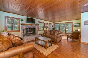 Newly furnished living room with wood burning fireplace.