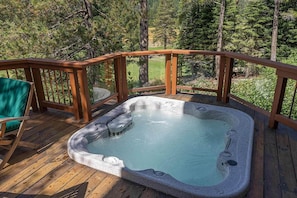 Relaxing hot tub overlooking golf course with mountain views of Squaw