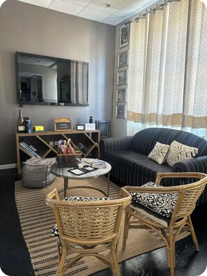 Downstairs open concept living space with 70 inch TV