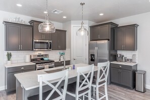 Kitchen Island - The Kitchen Island comfortably seats 3 adults and creates a great space for serving and preparing meals.