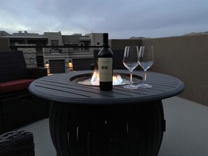 Outdoor Fire Pit at Dusk - Finish off the day enjoying the heat of the outdoor firepit.