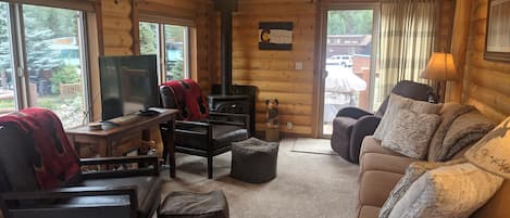 Living Room with gas fireplace, cable TV, and lots of comfortable seating