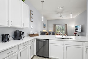 Dishwasher, and large sink worksurface to enable sitting at the counter