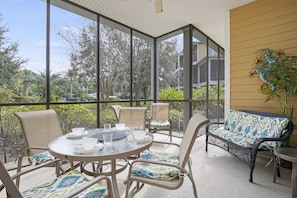 The oversized, screened lanai - 6 chairs can easily fit around a large table