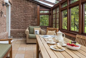 Ground floor: Conservatory dining set which guests are welcome to take out to the garden