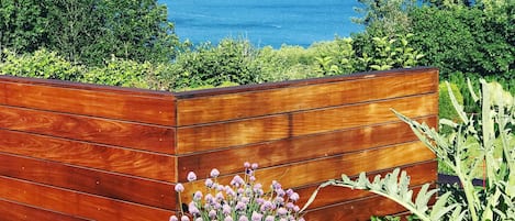 Deck with lake + mountain view