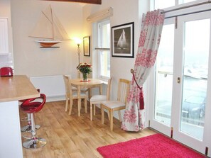 Dining area with a breakfast bar as well as an extending dining table  | Watch House, Fowey