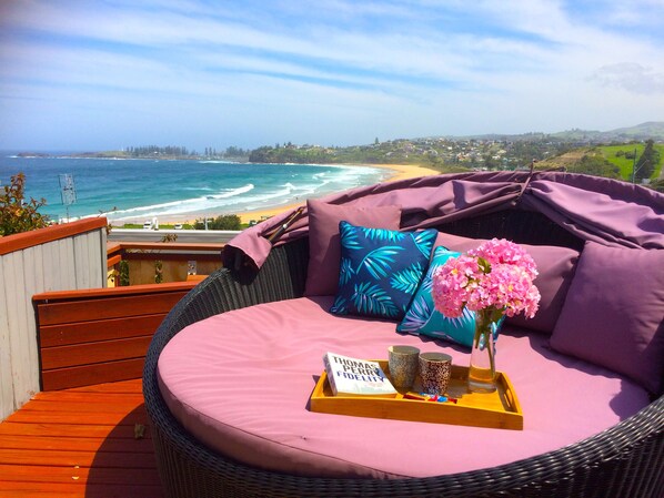 Amazing  views across Bombo beach, Kiama harbor and lighthouse from the daybed.
