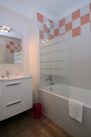 Get ready for your day in the lovely bathroom.
