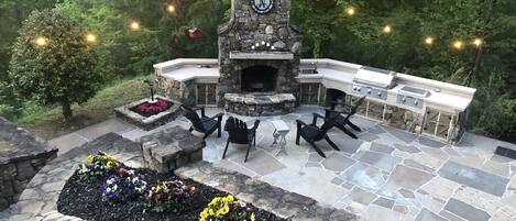 Incredible outdoor entertaining and cooking area with large fireplace. 