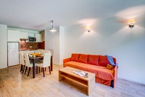 Sink into the cozy sofa after a day exploring the area.