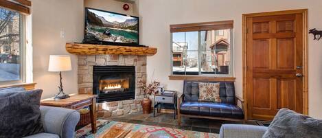 Bear Hollow Lodges 5474: Cozy setup with a stylish sofa, center table, and inviting fireplace.