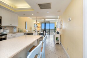 Entry into the unit, kitchen on left, guest bedroom on right