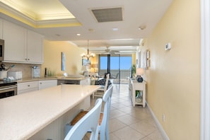 Entry into the unit, kitchen on left, guest bedroom on right