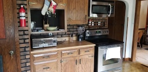 Kitchen area with stainless steel appliances -Basic cooking necessities supplied