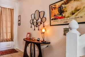 Entryway with fairytale mirror and Harry Potter decor.