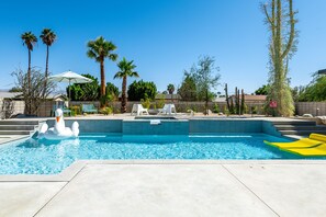 Expansive, multi-level patio with a variety of seating areas to sunbath or rest