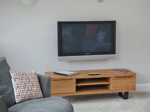 The living area has a large, flat screen TV with DVD player | St Monicas, Fowey