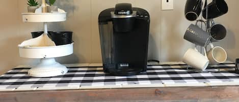 Coffee bar with a Keurig with a few K pods & sugar packs.
