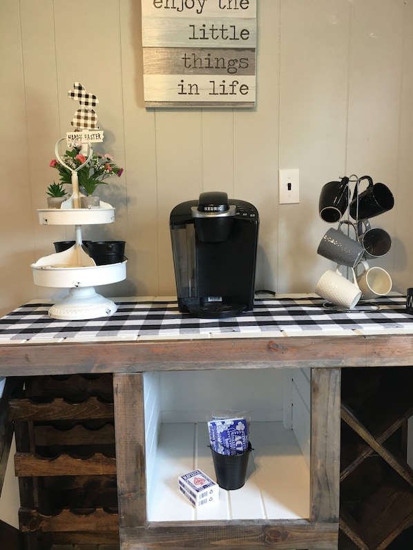 Coffee bar with a Keurig with a few K pods & sugar packs.
