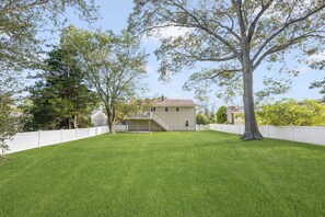 Beautiful fenced in backyard, with elevated deck to cook out on.