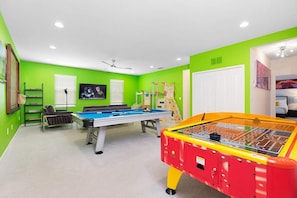 Air hockey and pool table in loft