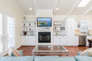 Bright and spacious, the main living area's open floor plan allows for easy group hangouts after a day at the beach.