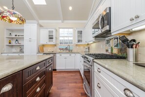 The kitchen comes stocked with dishes, utensils, cookware, bakeware, and major & small appliances. Guests must supply their own food, drinks (including coffee), spices, condiments, and paper goods.
                