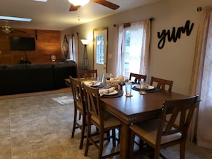 Large 6 person kitchen table, also included are 2 barstools. 