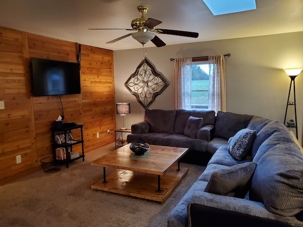 Large sectional couch in the main living room. Dish network and DVD's provided.