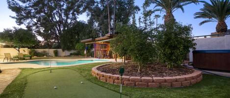 - - Perfect Your Putt: Practice Your Short Game on Your Private Putting Green, Just Steps Away from the Pool
