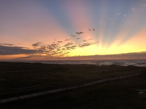 Enjoy Surfside sunrises from the front porch while sipping your coffee!
