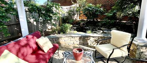 One of two great patios in backyard.  Backyard completely fenced in for privacy.