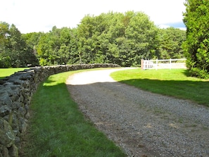 Entrance Drive bordered by stone wall