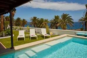 Soak in the sun and a seaside breeze by the poolside...