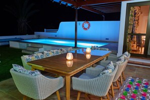 ...sit under a roof by the poolside...