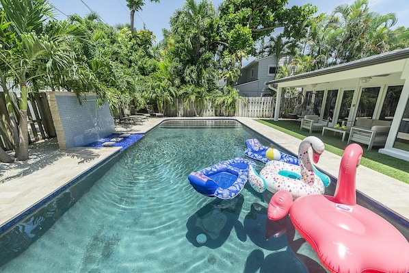 saltwater heated pool, waterfall, pool shelf with lounge chairs & umbrellla, bbq