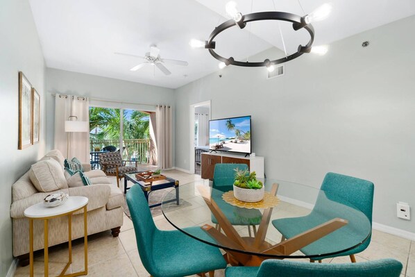 The living area features furnishings with space for dining and lounging - both indoors and out.