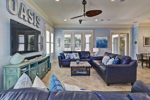 Living room overlooks the pool and the outdoor kitchen