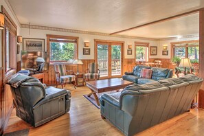 Upstairs, hardwood floors reflect the sunlight pouring in.