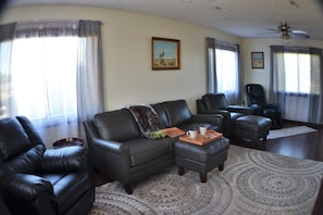 Lots of comfortable setting in the living room, upgraded massage chair