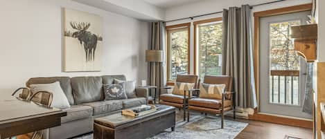 Luxury leather European Sofabed w/ stylish seating in open-concept Living Room. 