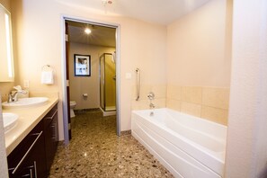 This bathroom features a shower and tub combination.