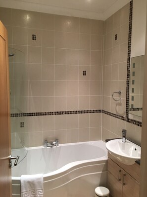 Family bathroom with bath & shower over